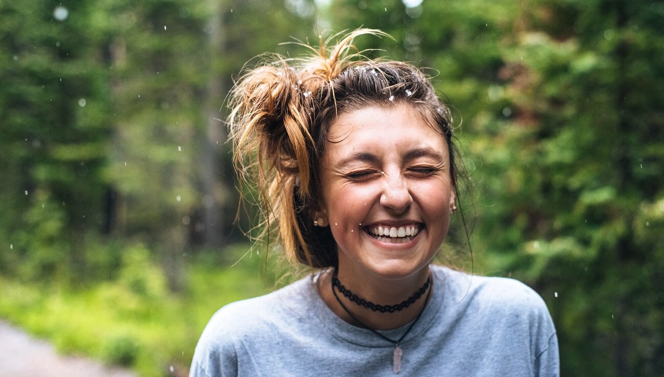 Young woman smiling in the forest